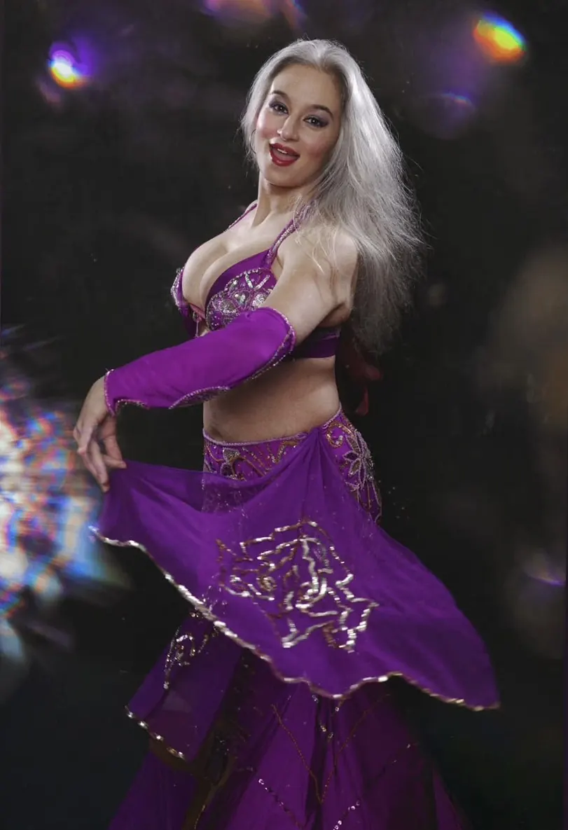 Alexandra performing in a violet bellydance costume