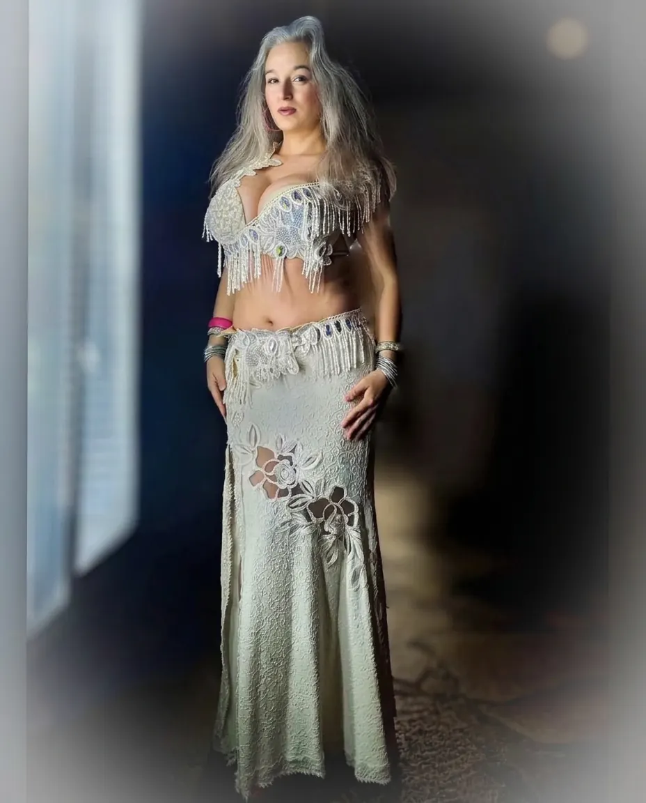 Alexandra in an ivory beaded costume, full-length editorial portrait